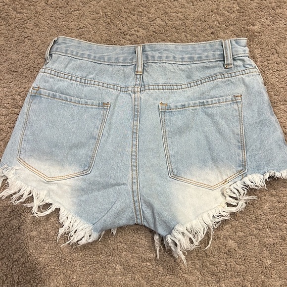 Light washed jean shorts, they are from shein, and they are a size 2! - Picture 2 of 2